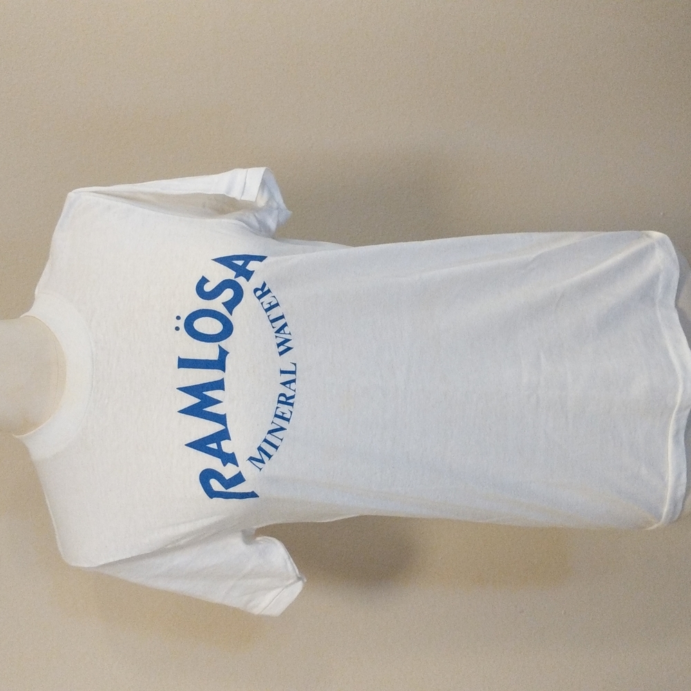 White short sleeved stretchy t-shirt with blue print of Ramlösa mineral water.
